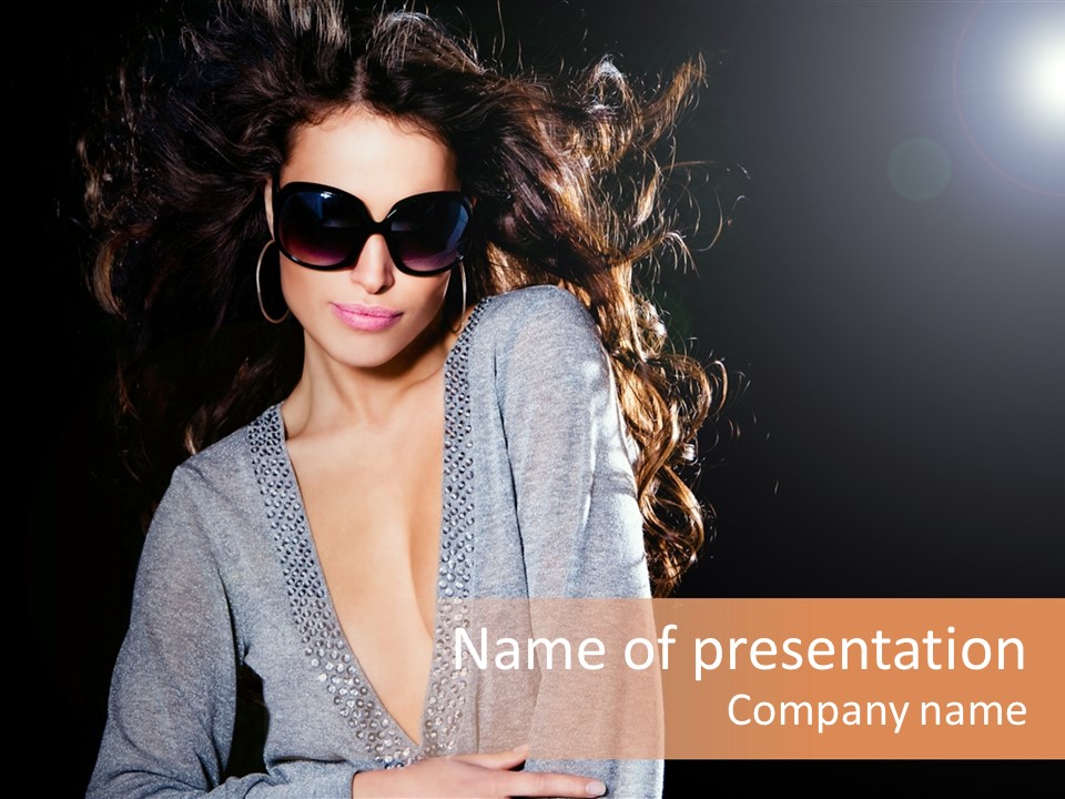 A Woman Wearing Sunglasses Is Posing For A Picture PowerPoint Template