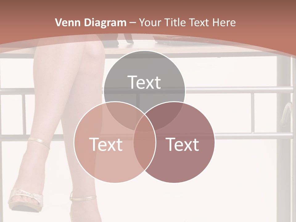 A Woman Sitting On A Desk Using A Laptop Computer PowerPoint Template