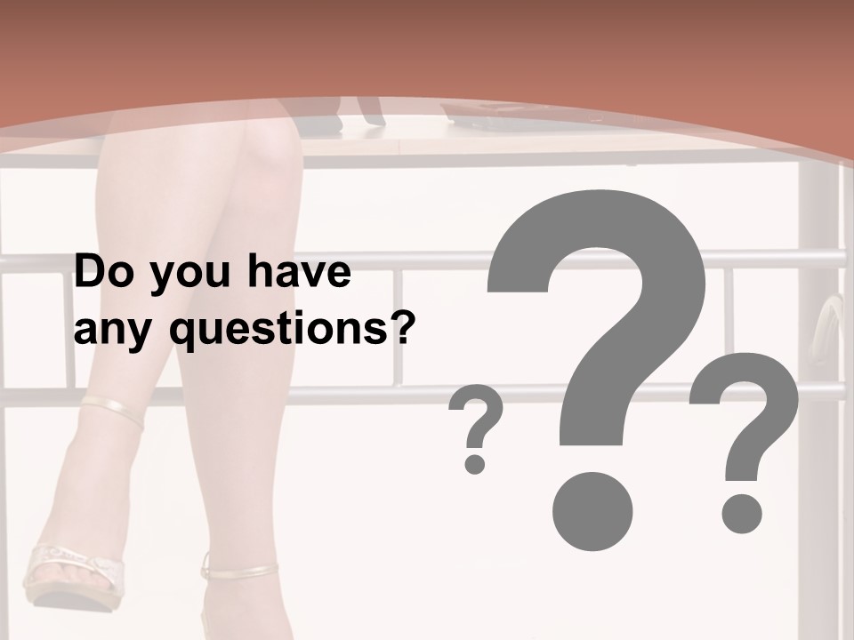 A Woman Sitting On A Desk Using A Laptop Computer PowerPoint Template