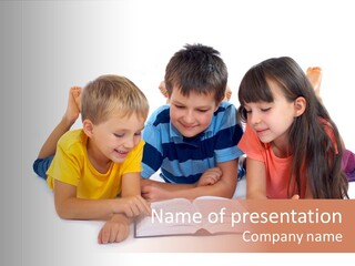 A Group Of Children Laying On The Ground Reading A Book PowerPoint Template