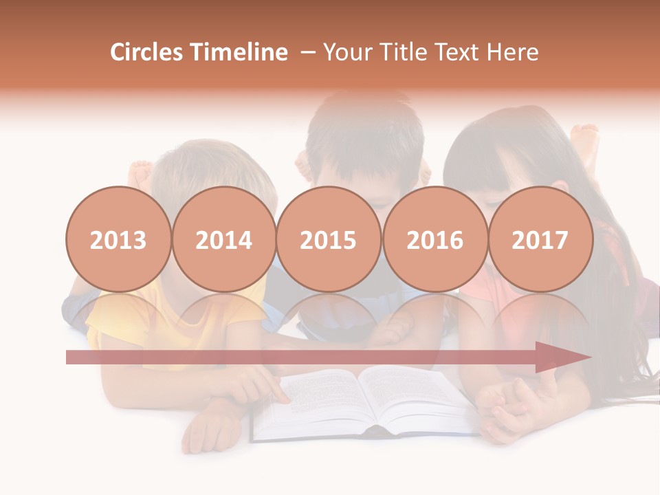 A Group Of Children Laying On The Ground Reading A Book PowerPoint Template