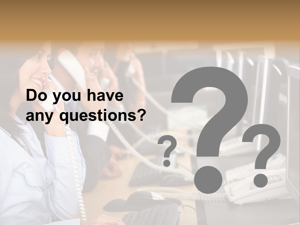 A Group Of People Sitting At A Desk Talking On Telephones PowerPoint Template