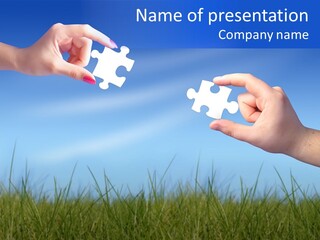 Two Hands Holding Pieces Of A Puzzle Together PowerPoint Template