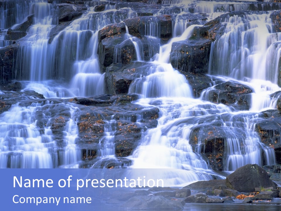 A Large Waterfall With Lots Of Water Coming Out Of It PowerPoint Template