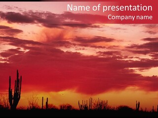 A Red Sky With Clouds Over A Desert PowerPoint Template