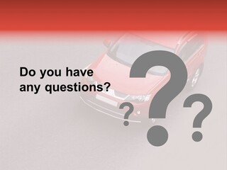 A Red Car Is Driving Down The Road PowerPoint Template