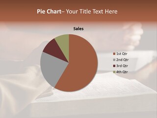 A Couple Prays Together At A Table As Their Hands Rest Upon Their Holy Bibles (Shallow Focus). PowerPoint Template