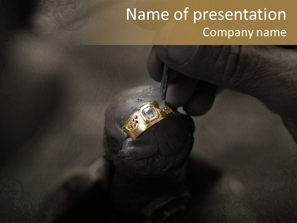 Goldsmith Working On An Unfinished 22 Carat Gold Ring With Big Diamond With His Hard Working Hands On Grunge Paper Background PowerPoint Template