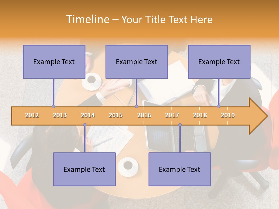 A Group Of People Sitting At A Table With Laptops PowerPoint Template