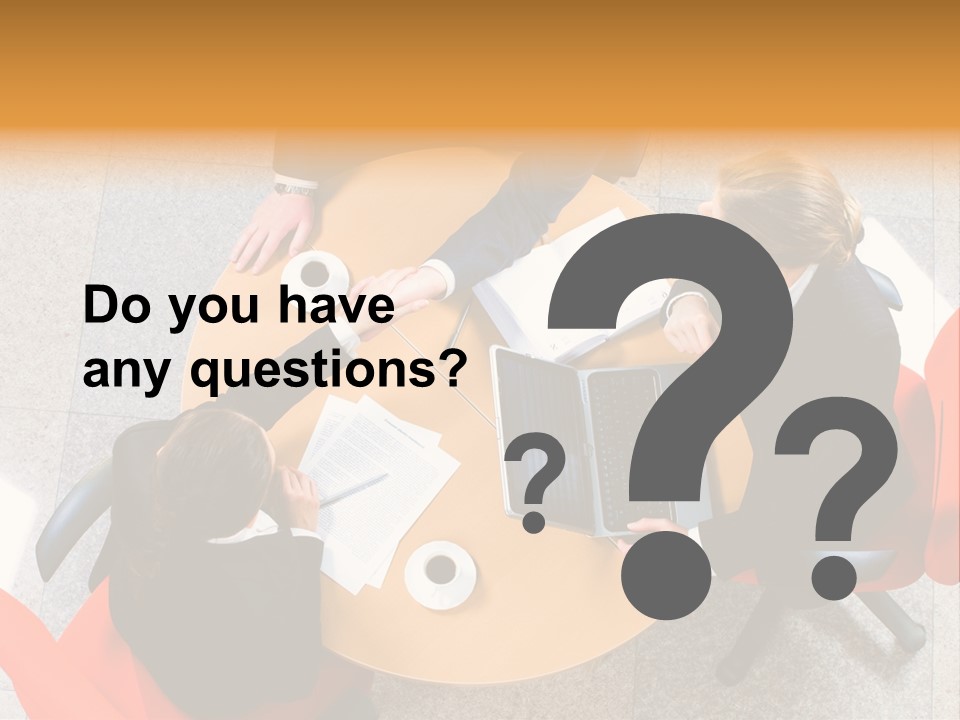 A Group Of People Sitting At A Table With Laptops PowerPoint Template