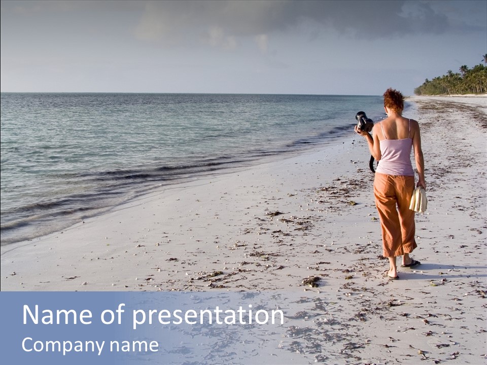 Photographer On Beach PowerPoint Template