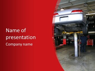 A Photo Of A Car On A Lift Getting Repaired PowerPoint Template