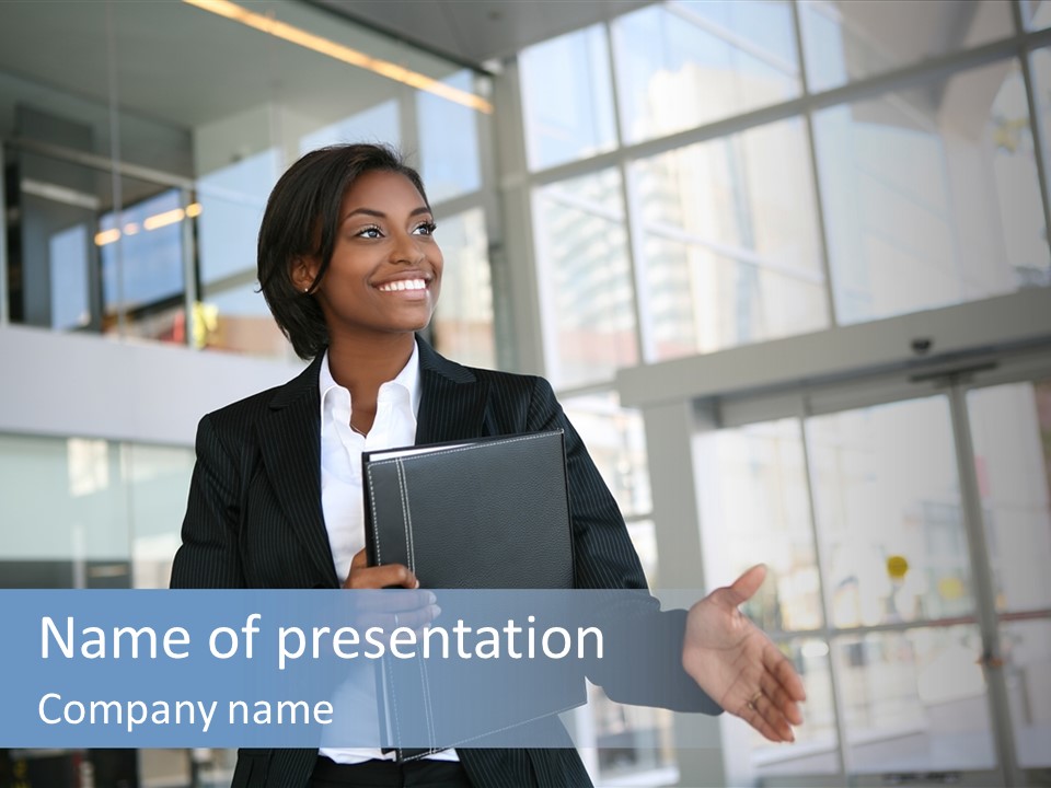 A Pretty African American Business Woman Offering A Handshake PowerPoint Template