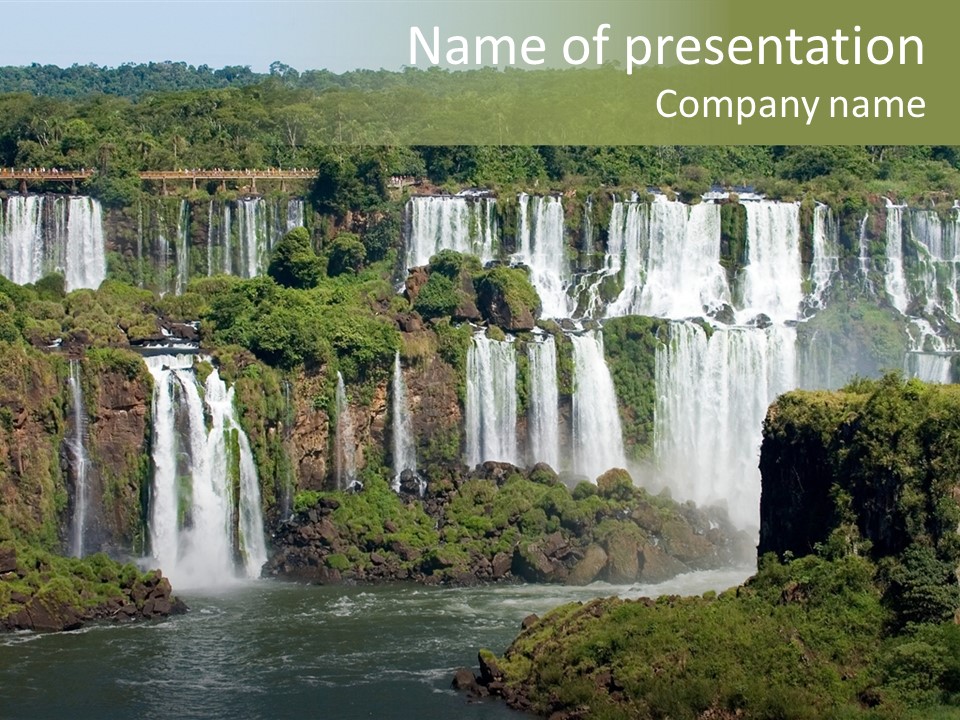 A Large Waterfall In The Middle Of A Body Of Water PowerPoint Template