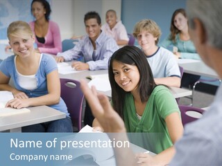 Group Of High School Students Listening To Teacher In Classroom PowerPoint Template