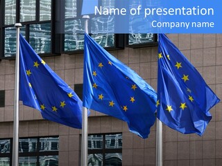 European Flags Floating In Front Of The European Council Building In Brussels PowerPoint Template