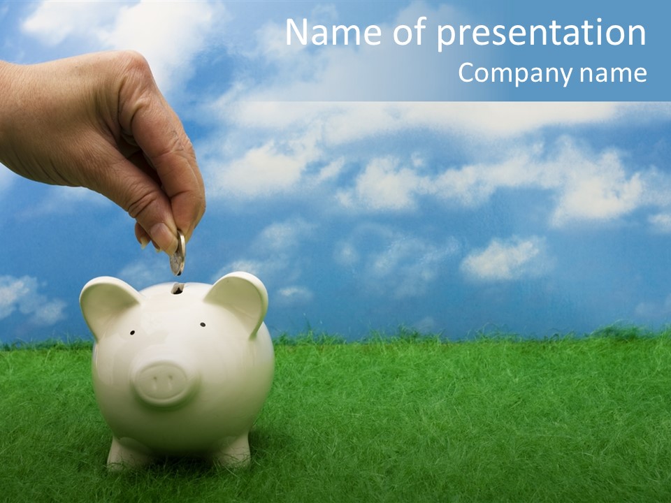 Coin Bank Sitting On Grass With Hand Putting In A Coin PowerPoint Template