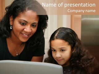 Woman In Her Kitchen With Daughter On The Computer PowerPoint Template