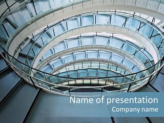 Round Stairway In The Middle Of Office Building PowerPoint Template