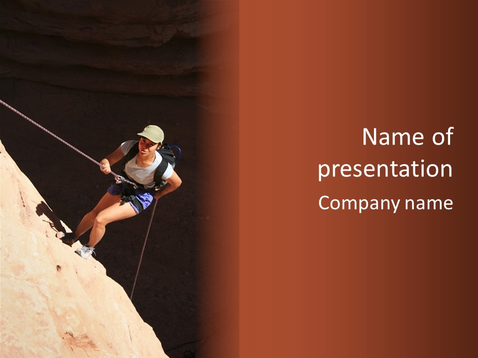 Canyoneering Asian Woman Rappels Into A Shadowed Canyon Bottom PowerPoint Template