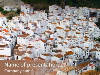 A Large Group Of White Buildings With Red Roofs PowerPoint Template