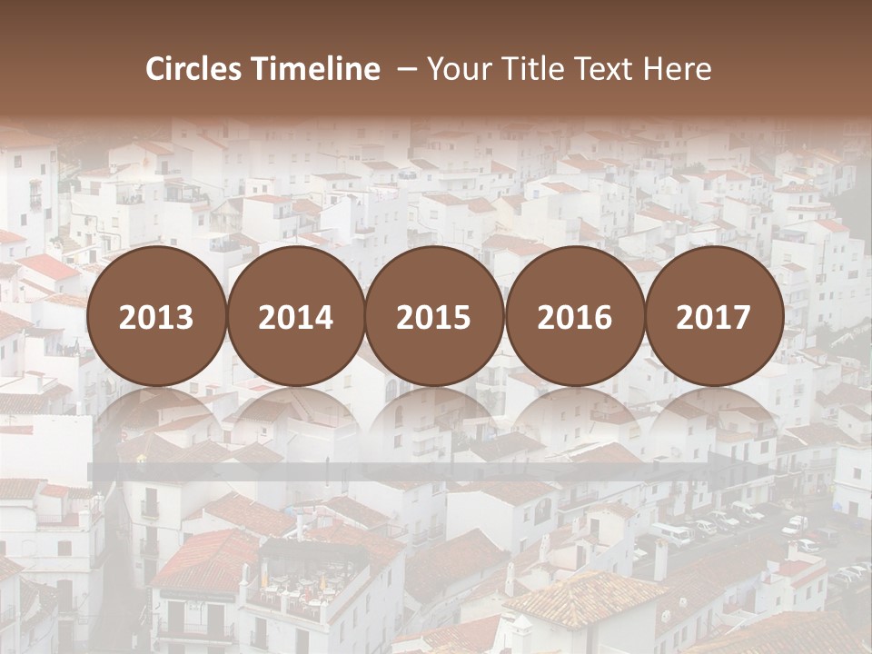 A Large Group Of White Buildings With Red Roofs PowerPoint Template