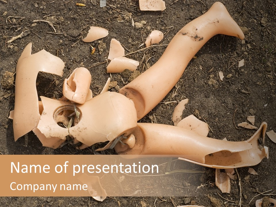 The Old, Broken Doll On The Ground PowerPoint Template