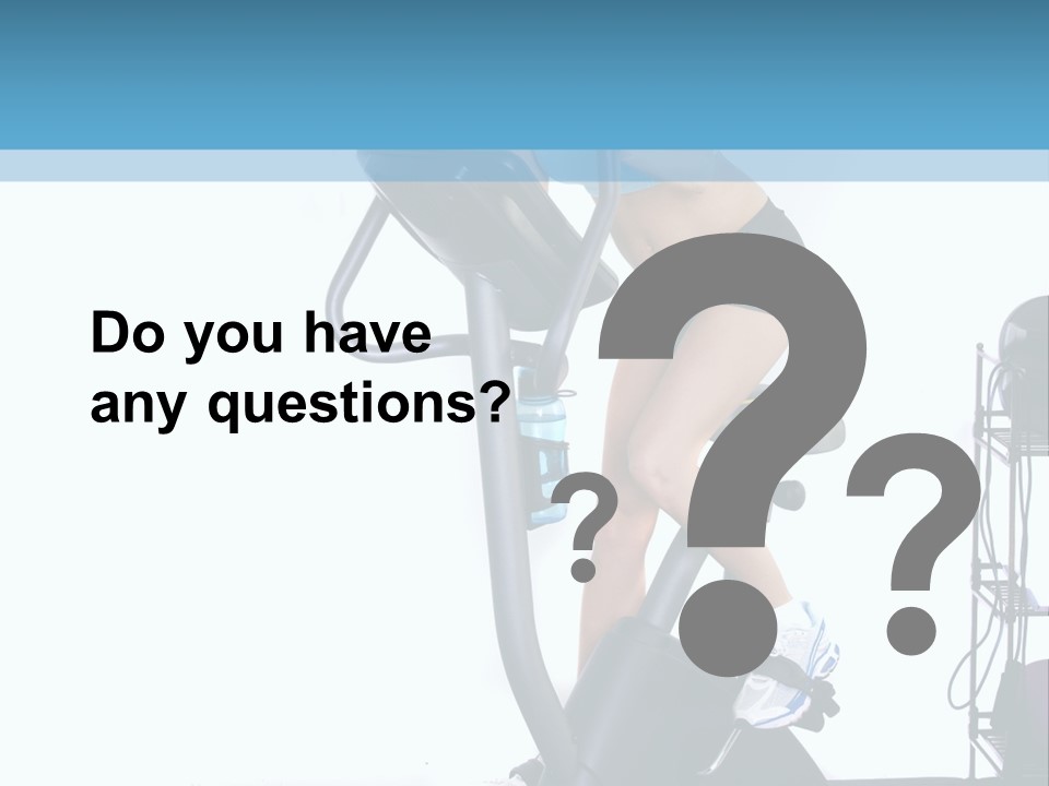 A Woman Is On A Stationary Exercise Bike PowerPoint Template