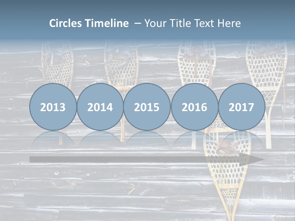 Old Snowshoes Nailed To The Side Of An Old Weathered Barn PowerPoint Template