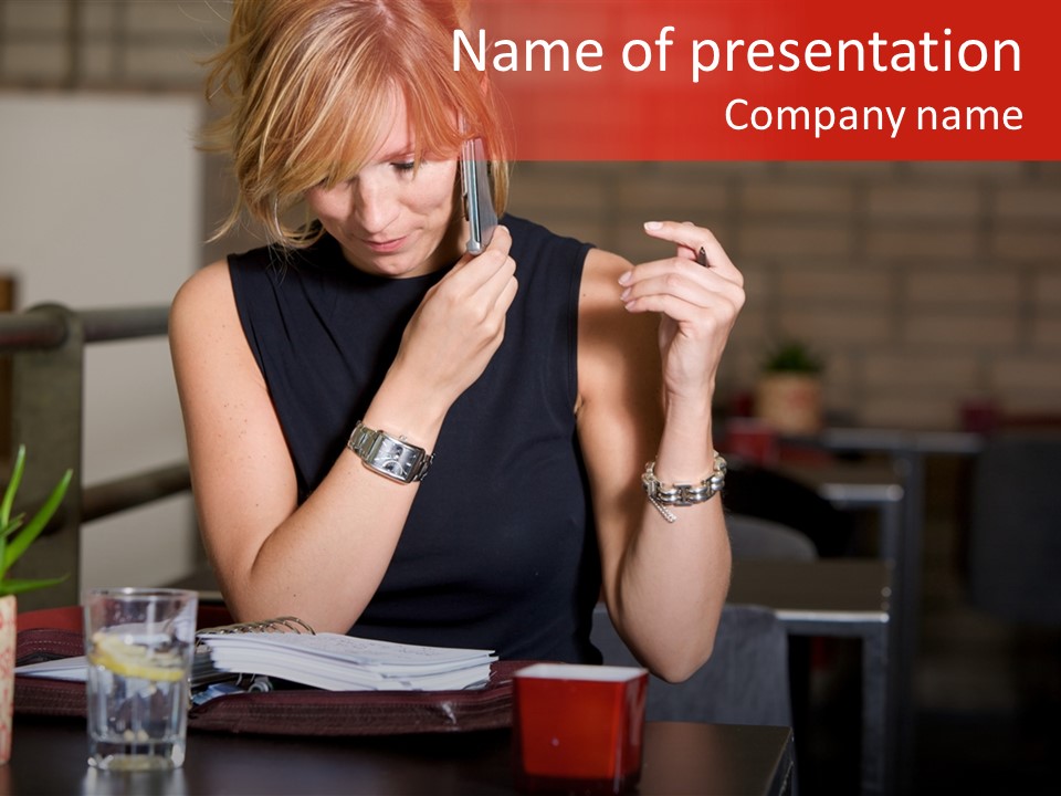 Pretty Blond Businesswoman Sitting In The Bar And Working PowerPoint Template