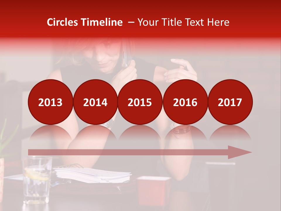 Pretty Blond Businesswoman Sitting In The Bar And Working PowerPoint Template