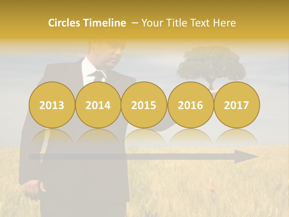 Businessman Holding A Tree In The Hand - Environment Concept - Focus On The Tree PowerPoint Template