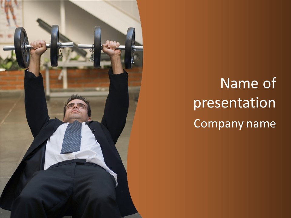 Vertically Framed Shot Of An Athletic, Young Businessman Bench Pressing Weights In A Gym PowerPoint Template