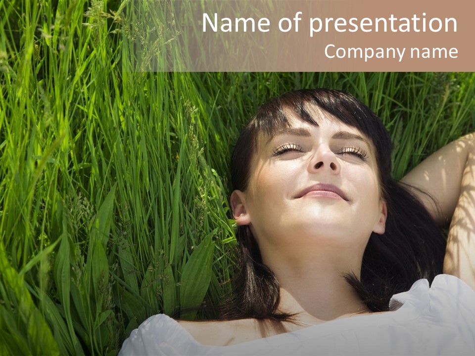 Beautiful Girl Lying Down Of Grass. Copy Space PowerPoint Template