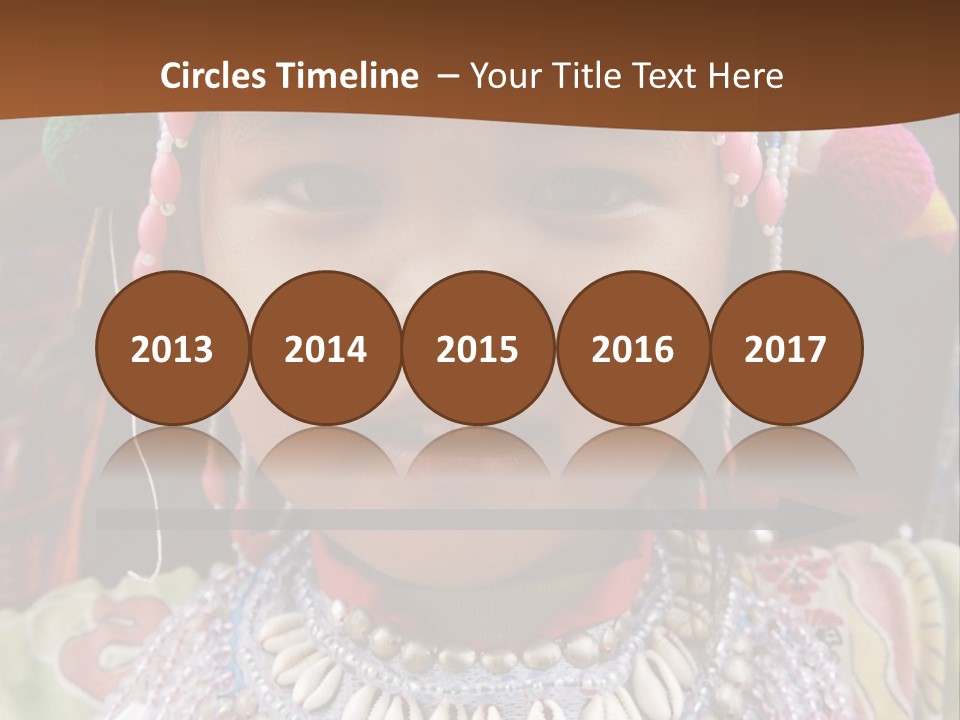 A Young Child Wearing A Headdress Is Smiling For The Camera PowerPoint Template