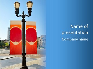 A Street Light On A City Street With Buildings In The Background PowerPoint Template