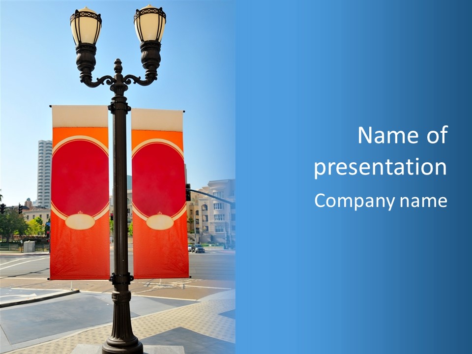 A Street Light On A City Street With Buildings In The Background PowerPoint Template