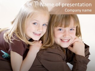 Two Cute Young Sisters Posing Together In A Studio. Horizontally Framed Shot Isolated Against A White Studio Background. PowerPoint Template