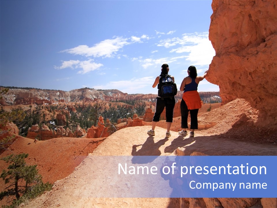 Hikers Looking At Landscape In Bryce Canyon National Park, Utah, Usa PowerPoint Template
