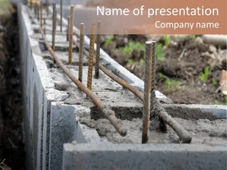 Closeup Of House Foundation Made From Concrete Shuttering Blocks Filled With Mortar And Reinforcement Bars PowerPoint Template