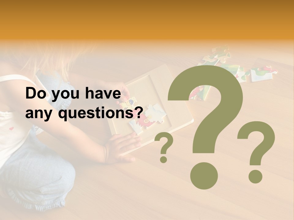 2-3 Years Old Girl Kneeling On The Floor And Solving Jigsaw Puzzle PowerPoint Template