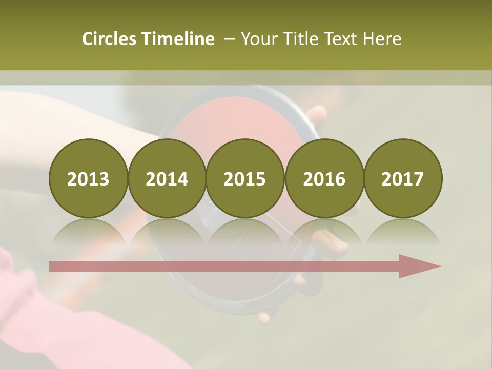 Discus In Hand With Athletic Field In Background PowerPoint Template