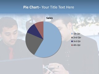 A Group Of Business People Looking At A Computer Screen PowerPoint Template