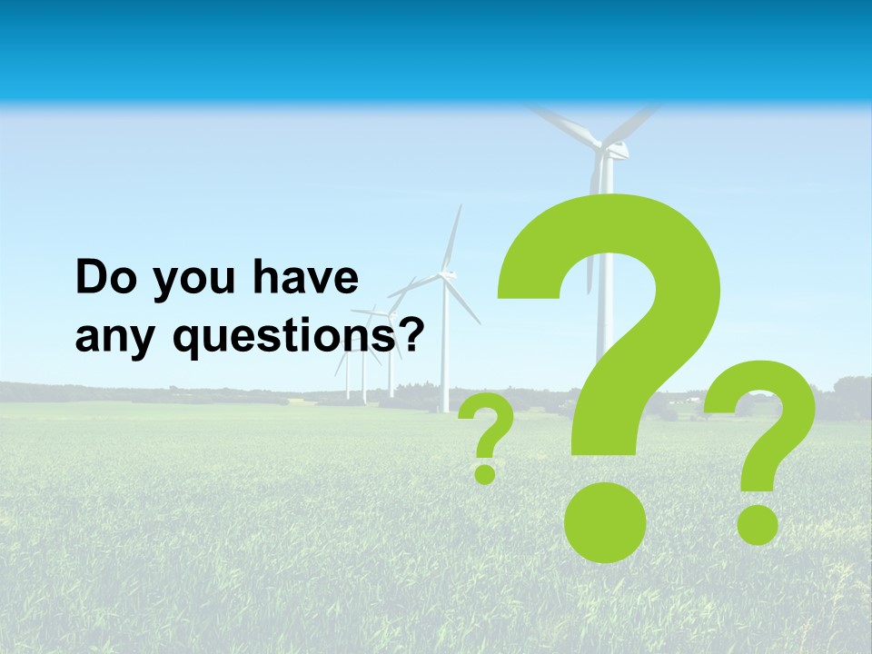 A Green Field With Windmills In The Background PowerPoint Template