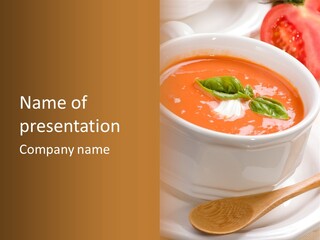 Closeup Of Bowls Of Delicious Tomato Soup Garnished With Cream And Basil Leaves PowerPoint Template