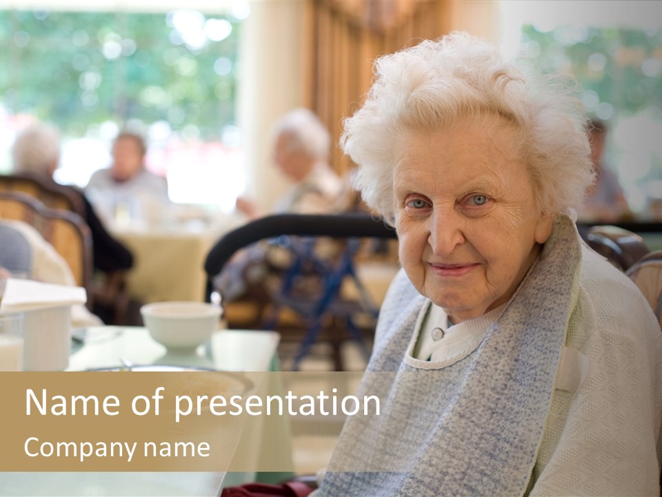 An Smiling Elderly Woman Sits Down To Enjoy A Meal At Her Nursing Home Care Center With A Sunny Background. PowerPoint Template