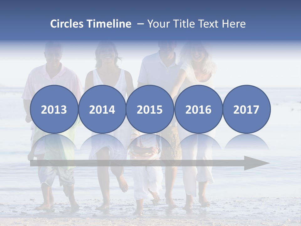 Extended Family Walking On Beach PowerPoint Template