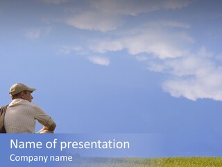 A Man Sitting On The Grass PowerPoint Template