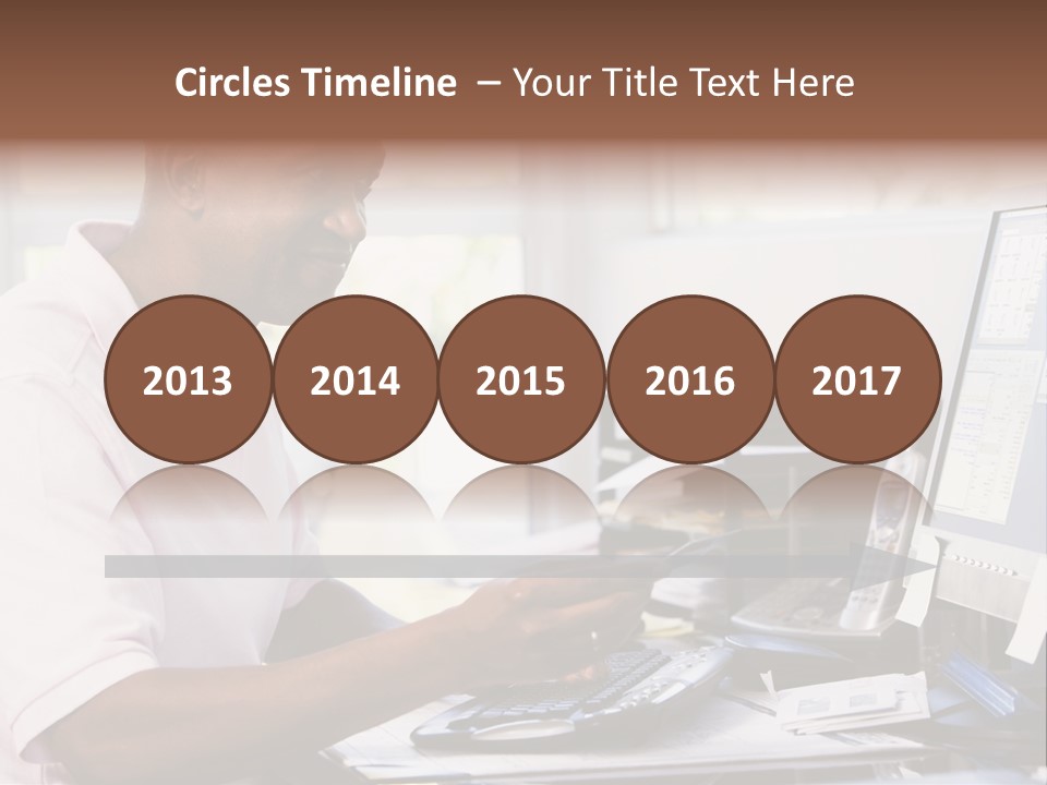 Man In Home Office Using Computer Holding Credit Card And Smiling PowerPoint Template