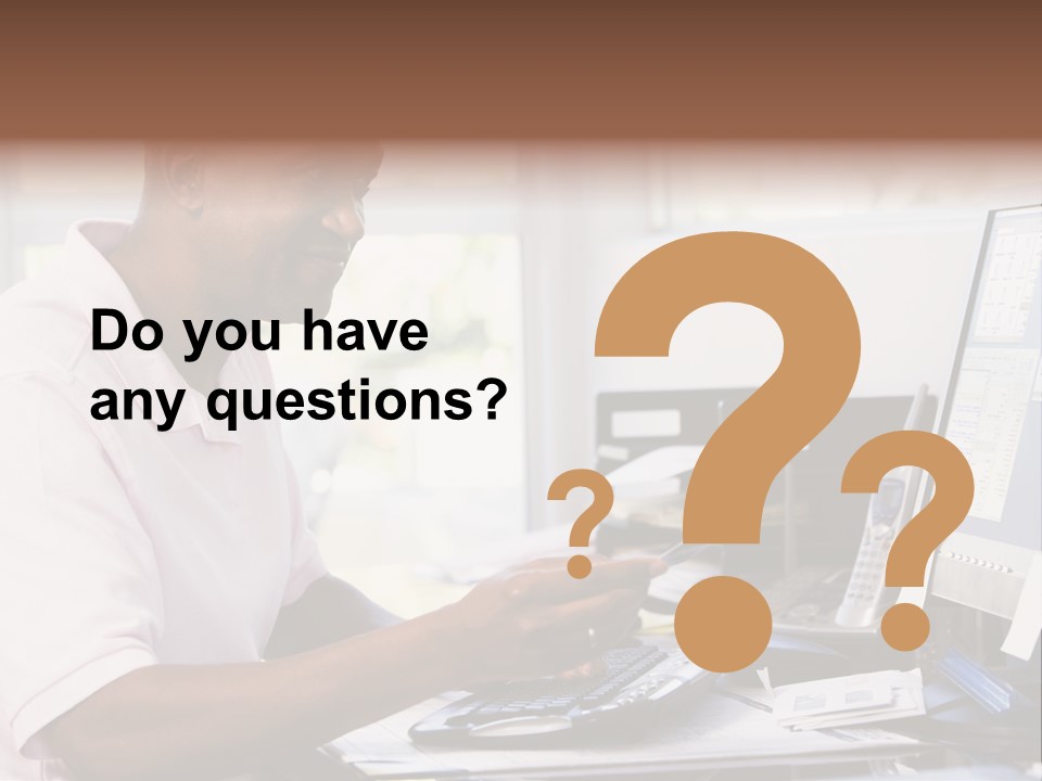 Man In Home Office Using Computer Holding Credit Card And Smiling PowerPoint Template